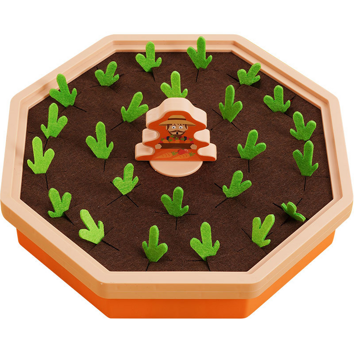 Nærbillede af PlayPatch magnetisk gulerodsspil. Barn øver finmotorik med magnetisk pen og farverige gulerødder.