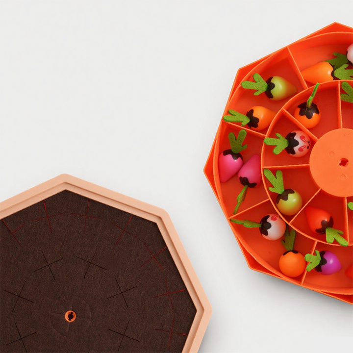 Barn koncentrerer sig om PlayPatch gulerodsspil. Magnetisk trælegetøj træner fokus og problemløsning.