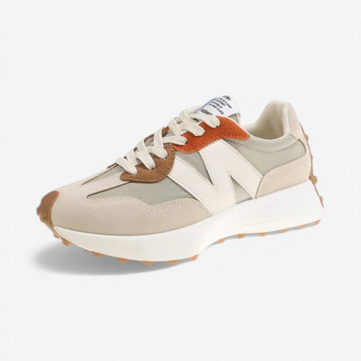 Blå letvægts sneakers til kvinder. Skridsikker sål, spids tå og justerbare snørebånd for komfort.