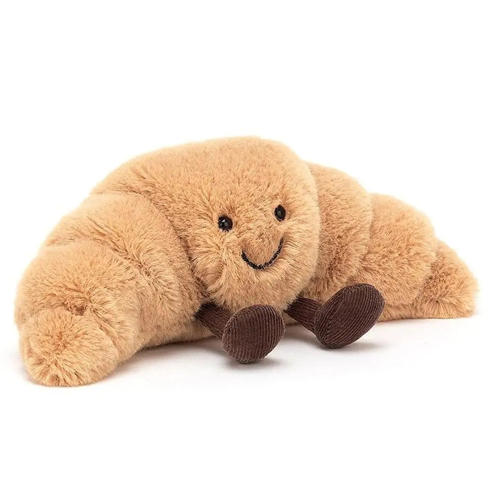 Blød og fluffy croissant krammebamse, et dejligt plysdyr for hygge og afslapning.