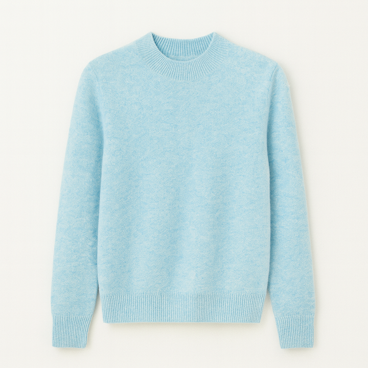 Nærbillede af den bløde strik på en dame sweater med rund hals. Ensfarvet kvalitet.