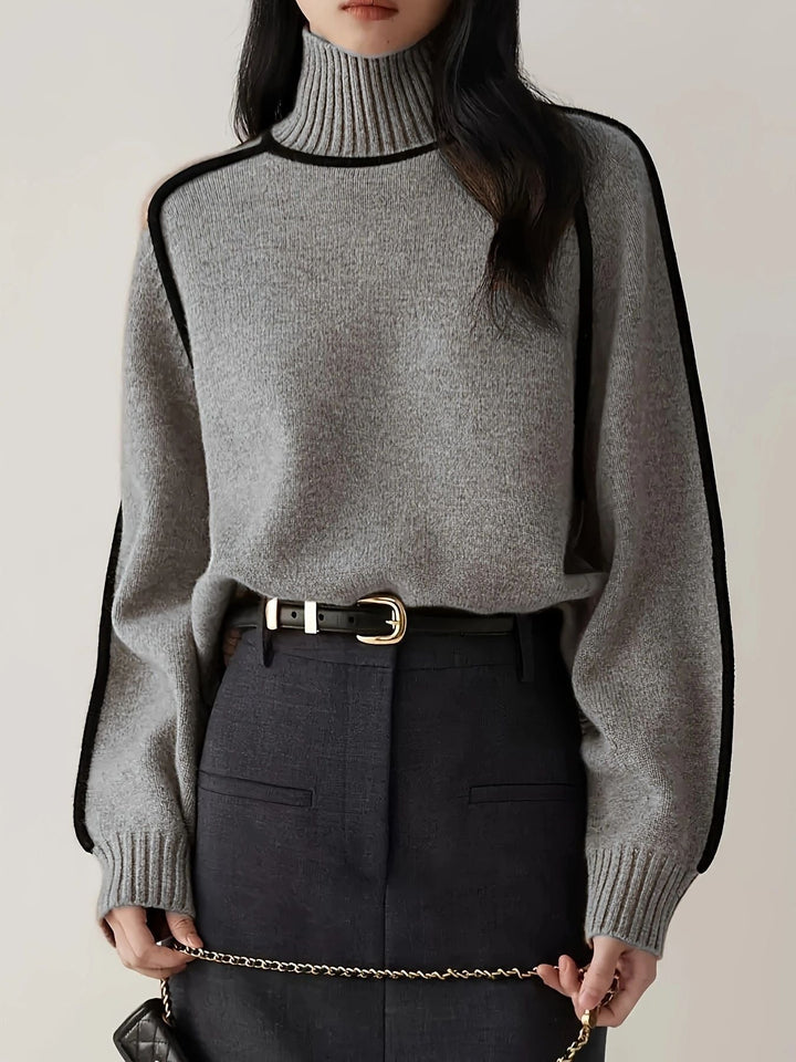 Stilfuld langærmet dametop. Blød og komfortabel sweater, ideel som hverdagstøj.