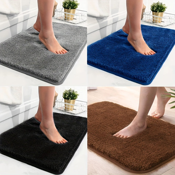En SoftStep absorberende bademåtte i beige nuance, der holder badeværelset tørt og rent med stil.