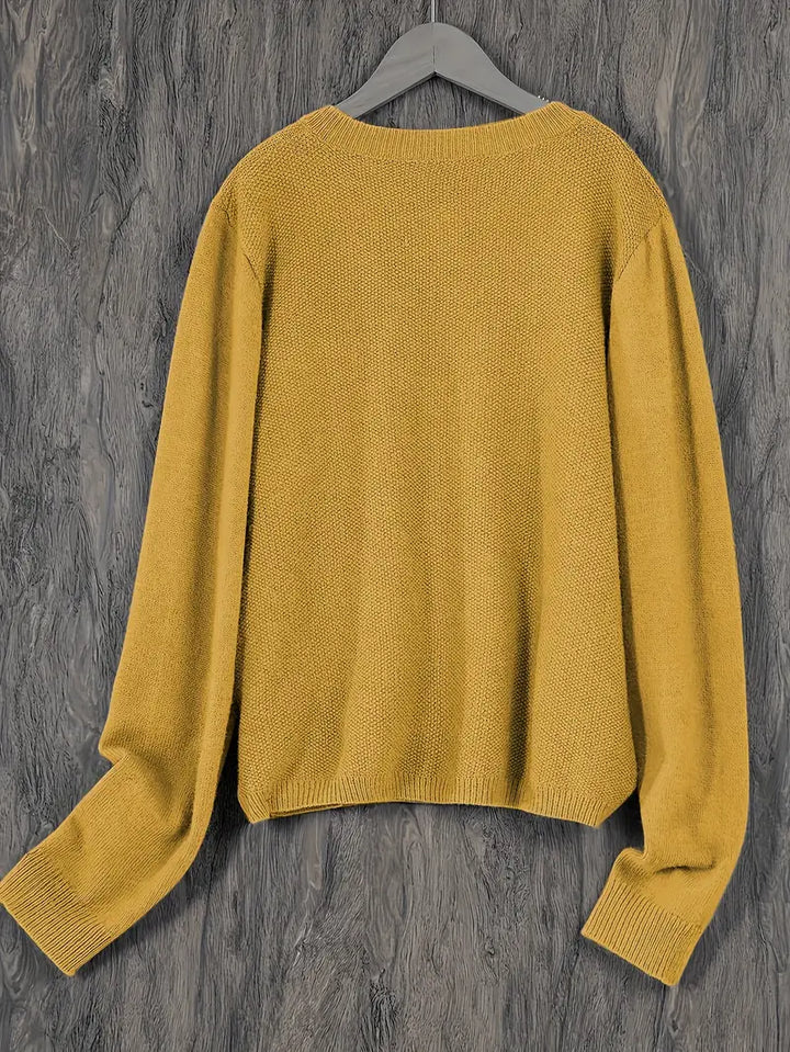 "Blød oversized uld strikcardigan til kvinder, elegant og komfortabel med afslappet pasform og praktiske lommer."