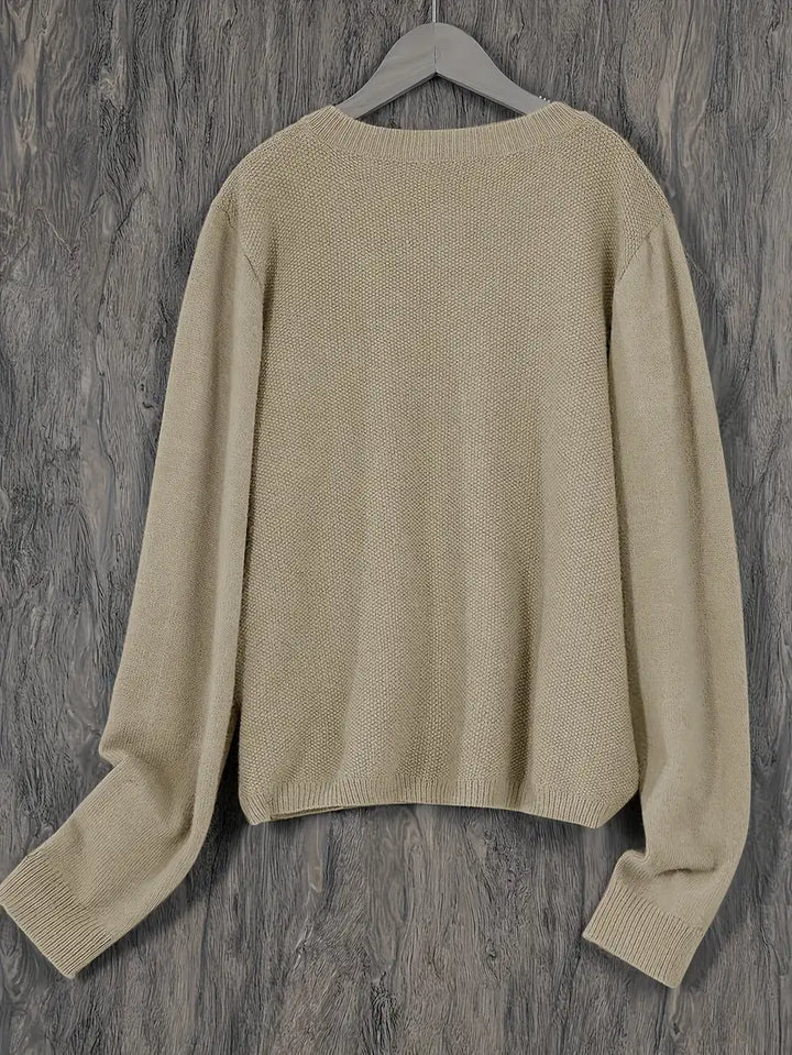 "Blød oversized uld strikcardigan til kvinder, elegant og komfortabel med afslappet pasform og praktiske lommer."