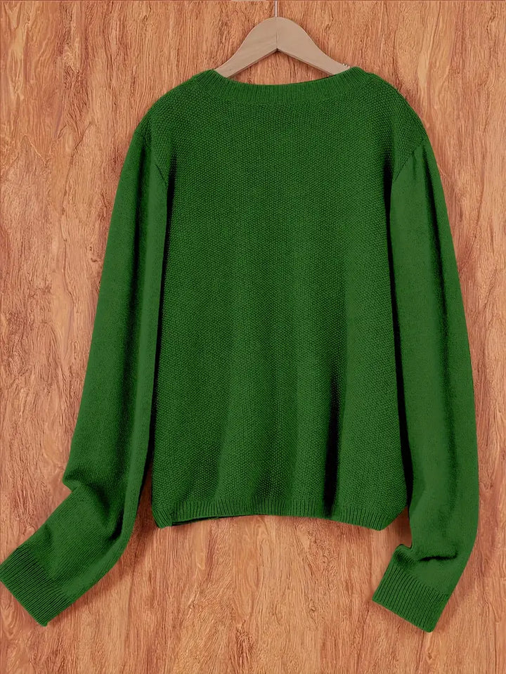 "Blød oversized uld strikcardigan til kvinder, elegant og komfortabel med afslappet pasform og praktiske lommer."