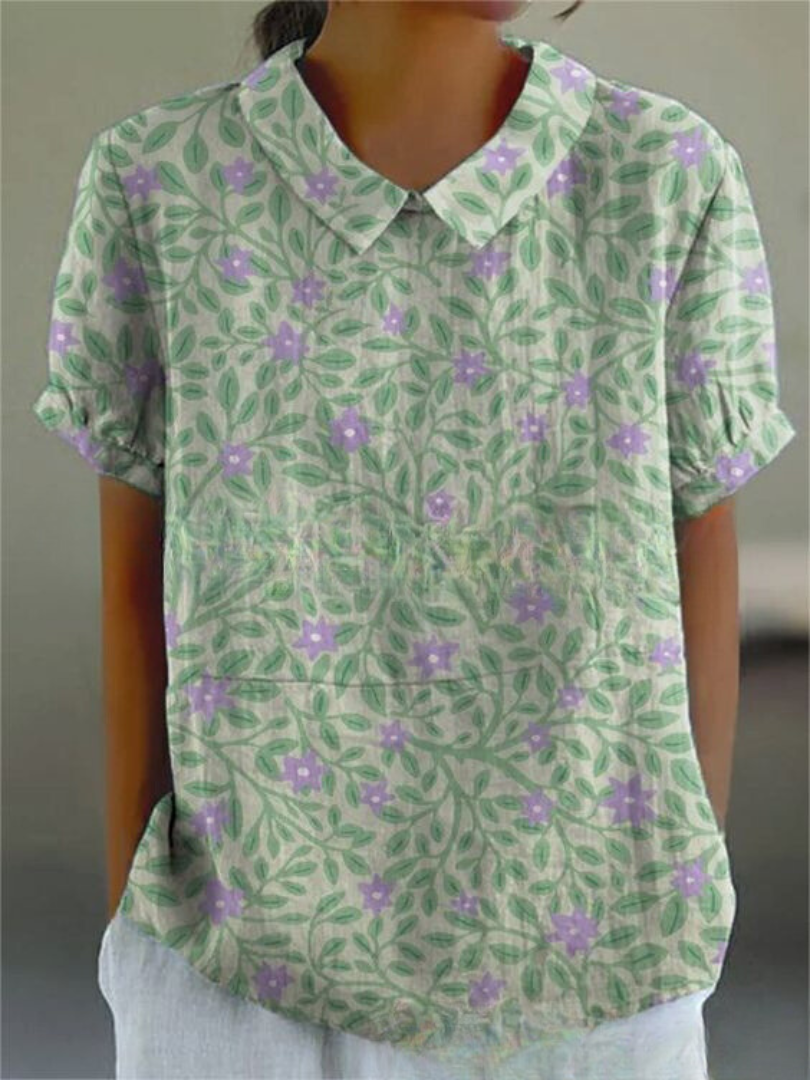 Elegant kvinde bluse med farverigt blomsterprint, perfekt til afslappede dage, tilbyder både stil og komfort.