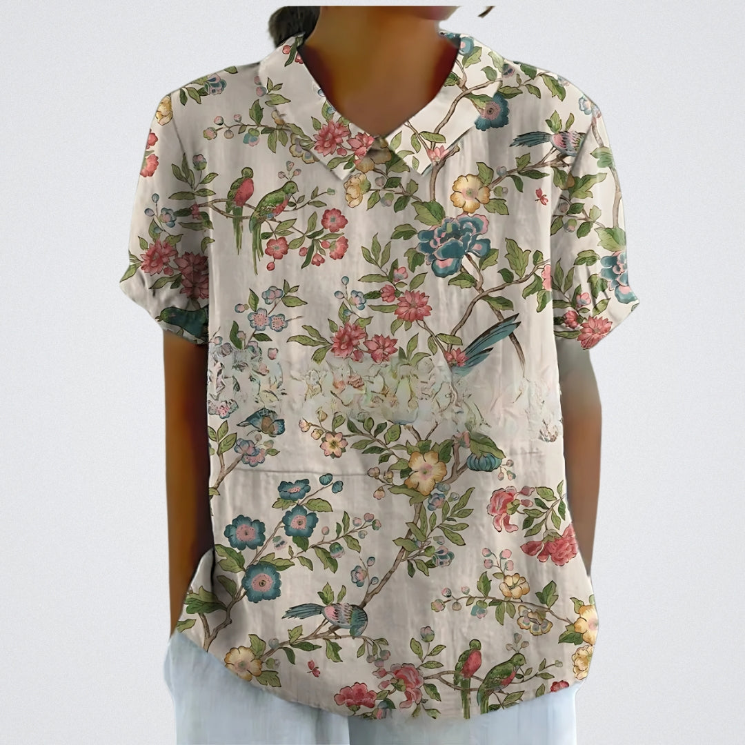 "Blomstret linnedtop til damer, let og åndbar med elegant blomstermønster for sommerdage, afslappet stil og komfort."