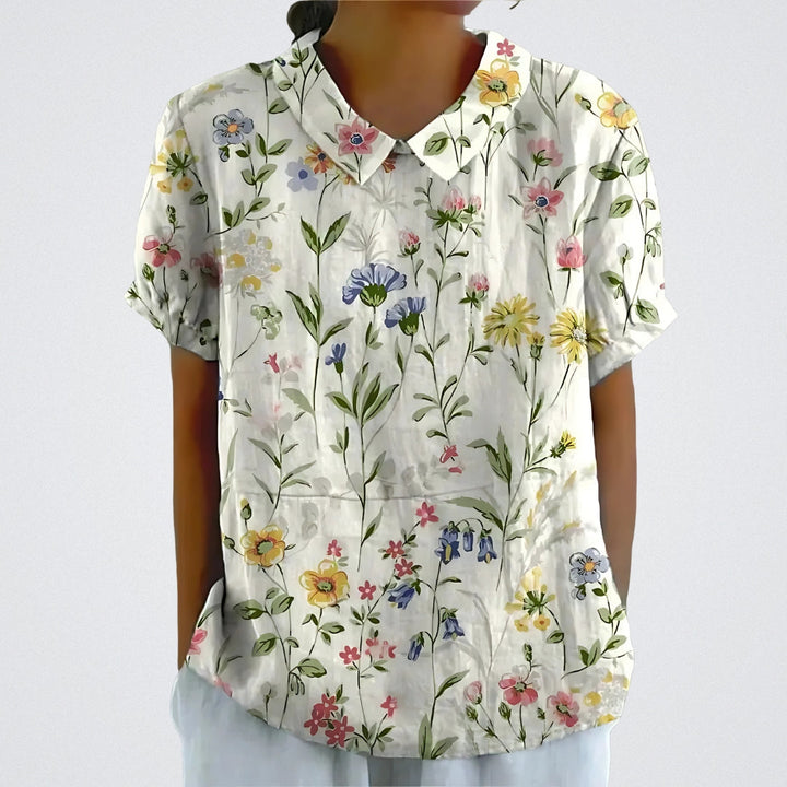 "Blomstret linnedtop til damer, let og åndbar med elegant blomstermønster for sommerdage, afslappet stil og komfort."
