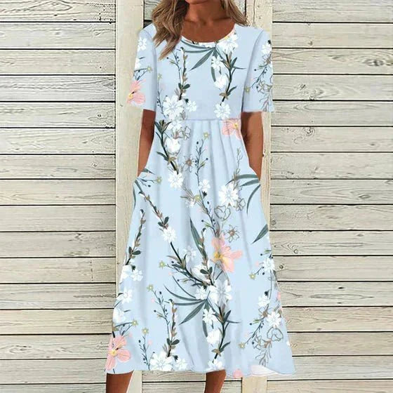 Blomstret maxi kjole i gul og lyseblå, elegant og afslappet stil, perfekt til både formelle og afslappede begivenheder.