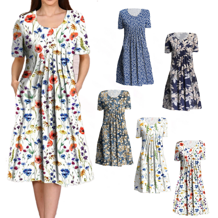 "Blomstret sommer midi kjole, let stof, afslappet pasform, lommer, feminint design, perfekt til varme dage"