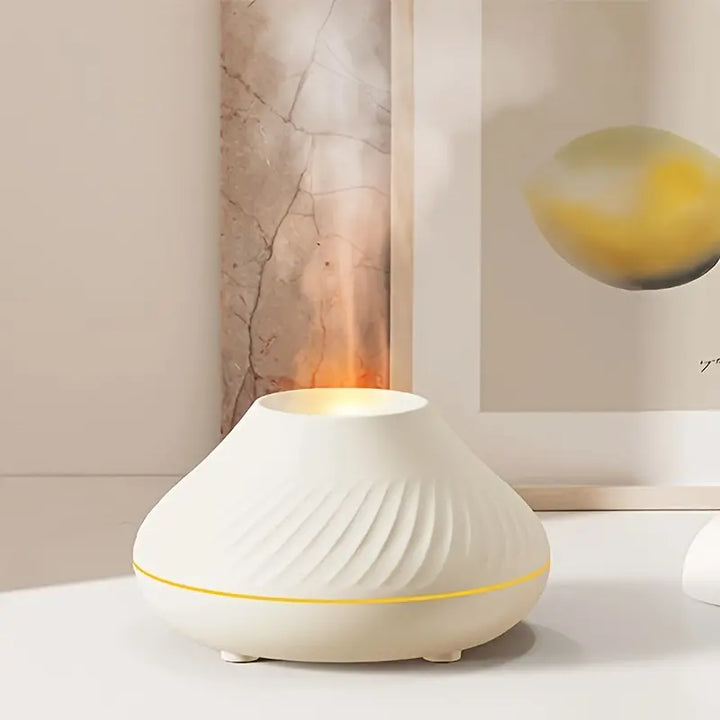 Elegant CalmMist aroma diffuser med hyggelig flammeeffekt og stemningslys for afslapning i hjemmet.
