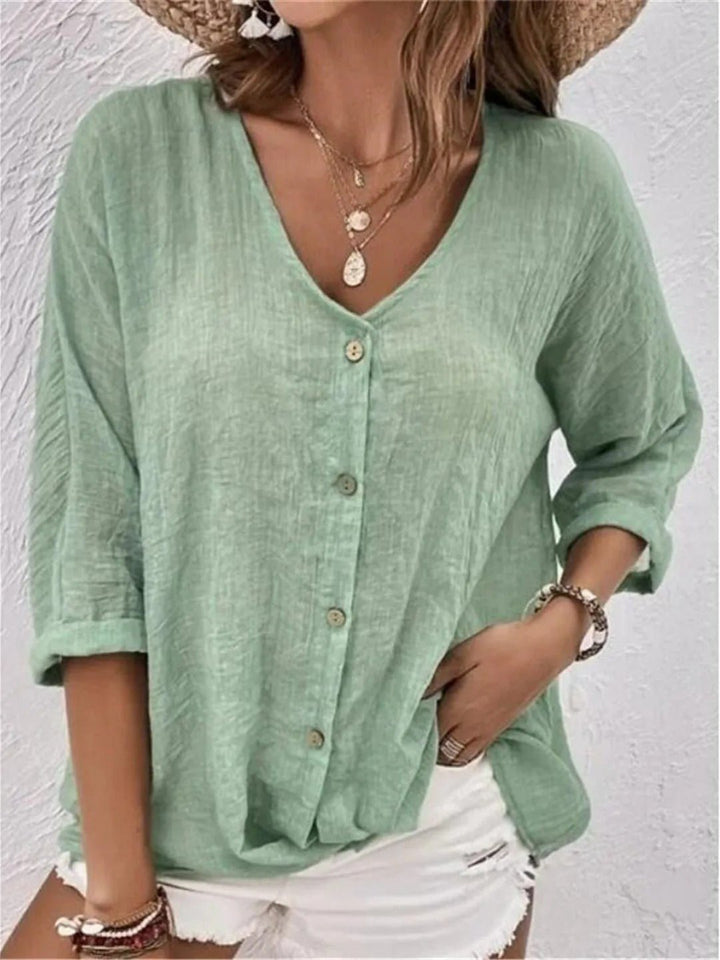 Trekvart ærme på oversized damebluse i bomuld. Casual og behagelig sommertop til kvinder.