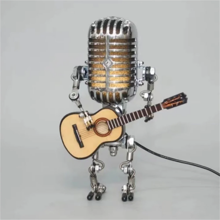 Detaljeret robot bordlampe med musiktema og blødt LED lys. Skaber hygge og varme i indretningen.