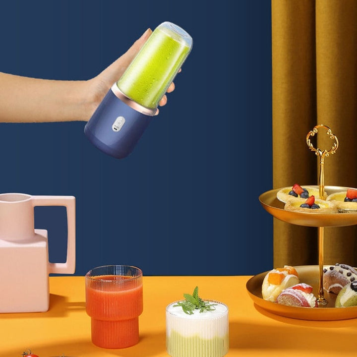 "Citruspresser i moderne design, kompakt og bærbar, effektiv juicing af frugt i køkkenet eller på farten"
