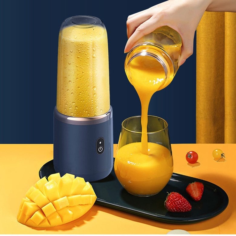 "Citruspresser i moderne design, kompakt og bærbar, effektiv juicing af frugt i køkkenet eller på farten"