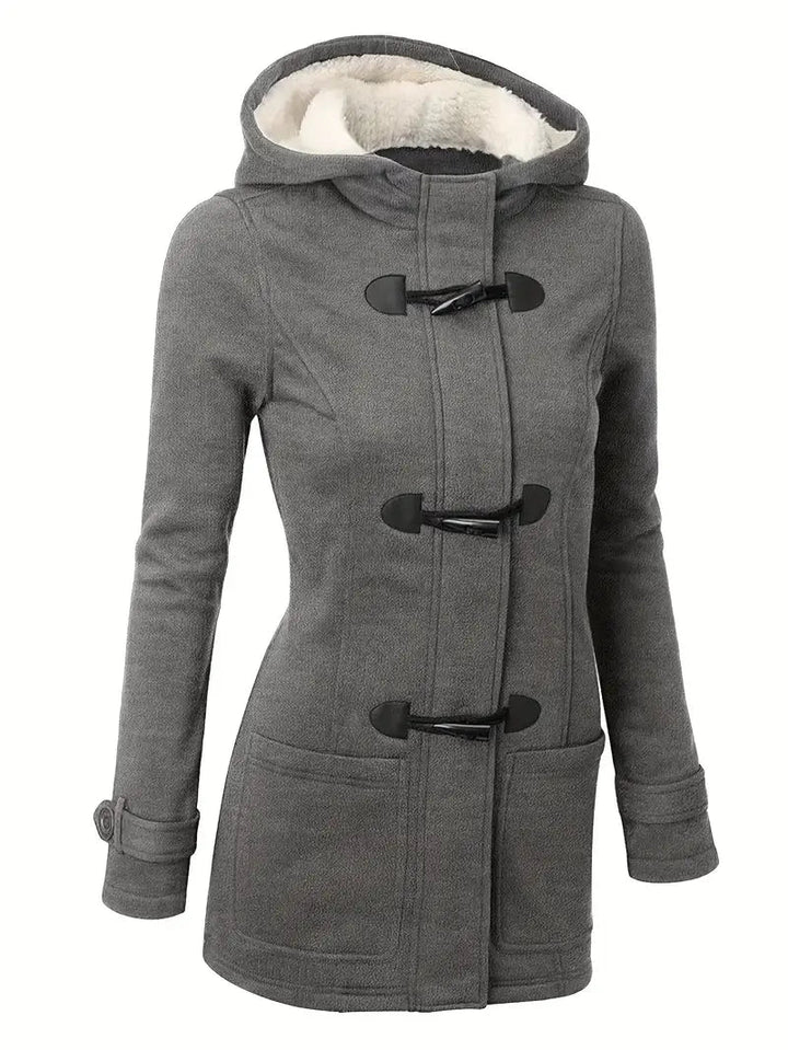 Varm dame duffelcoat med hætte. En modebevidst og komfortabel vinterfrakke, ideel til koldt vejr.