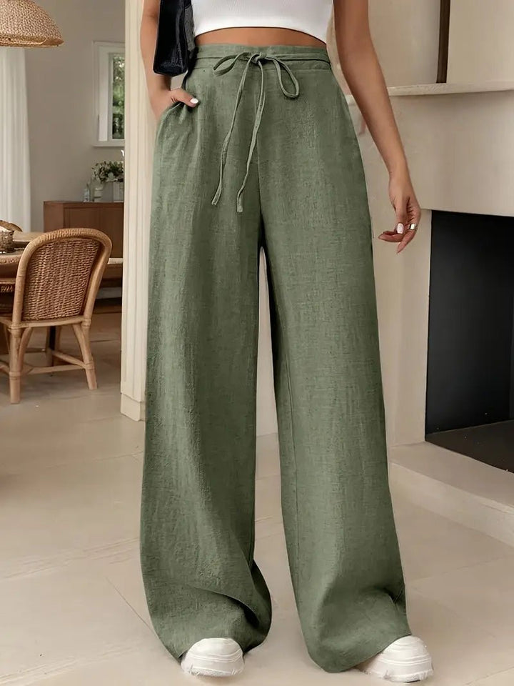 Dame højtaljede wide leg bukser i luftigt hør. Perfekte til afslappet elegance, forår & sommer.