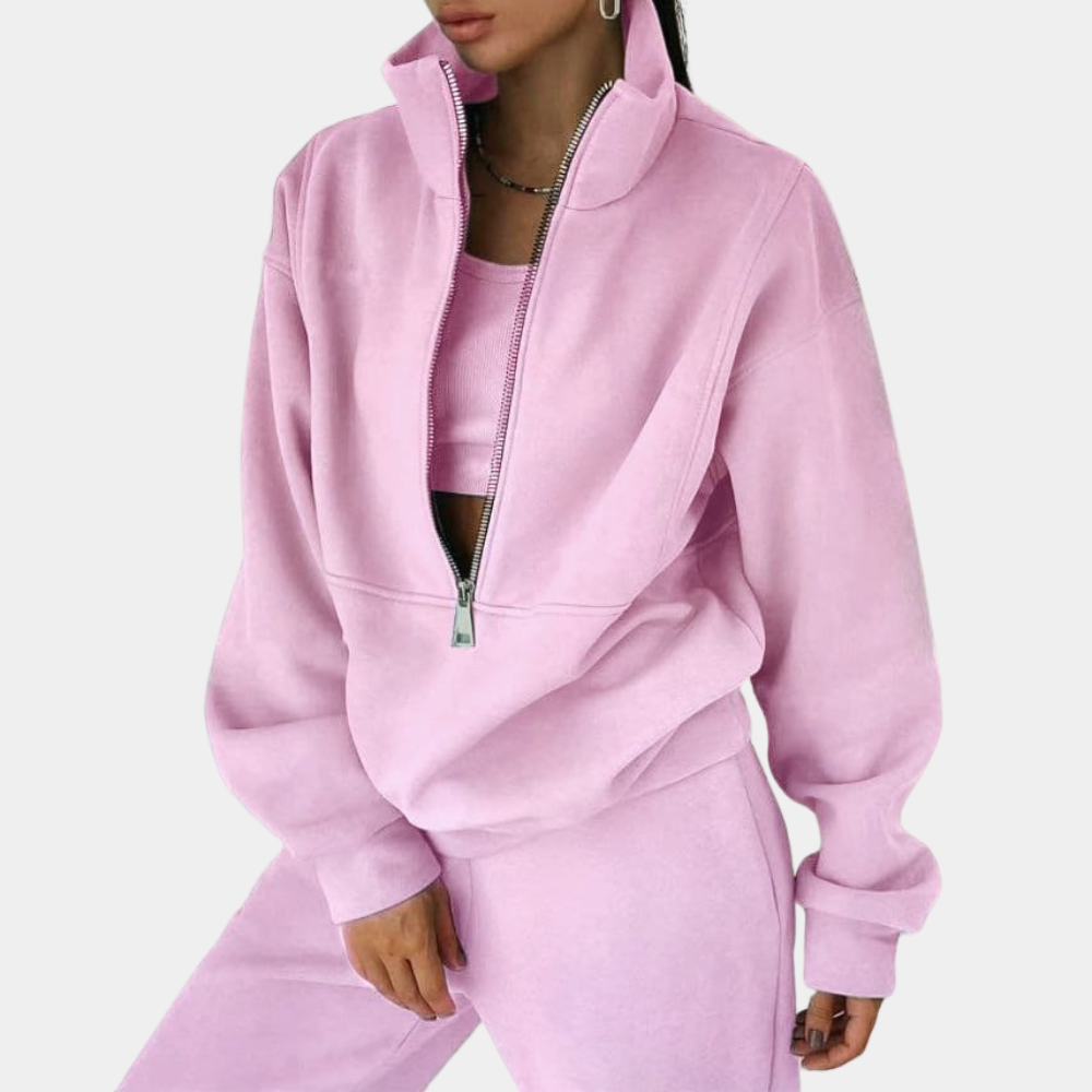 Dame joggingsæt med halv lynlås i pink. Komfortabelt, trendy athleisure sæt til hverdag.
