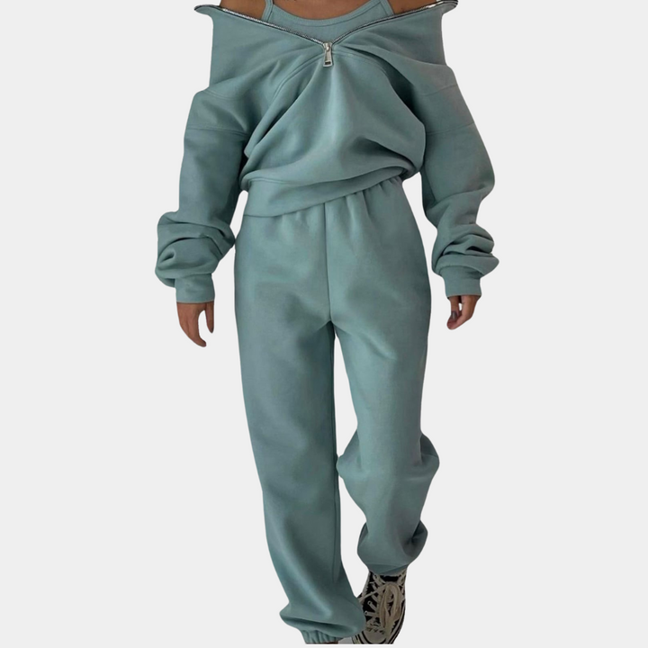 Trendy oversized dame joggingsæt i pink med halv lynlås. Komfortabelt co-ord sæt til moderne kvinder.