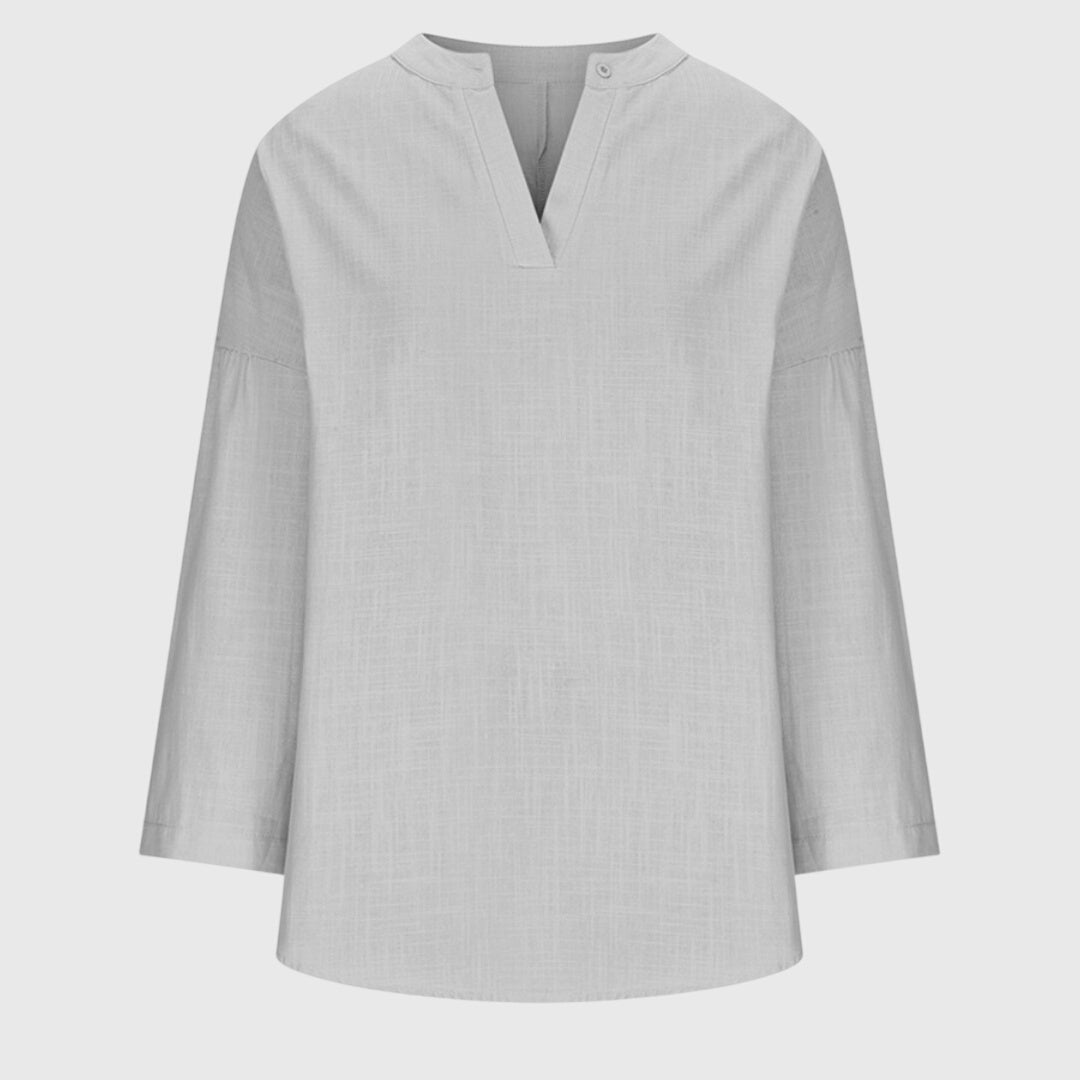 Enkel og stilren dame langærmet top med løs pasform. Komfortabelt hverdagstøj for et moderne look.