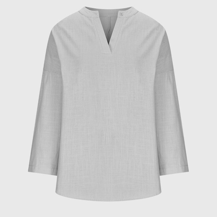 Enkel og stilren dame langærmet top med løs pasform. Komfortabelt hverdagstøj for et moderne look.