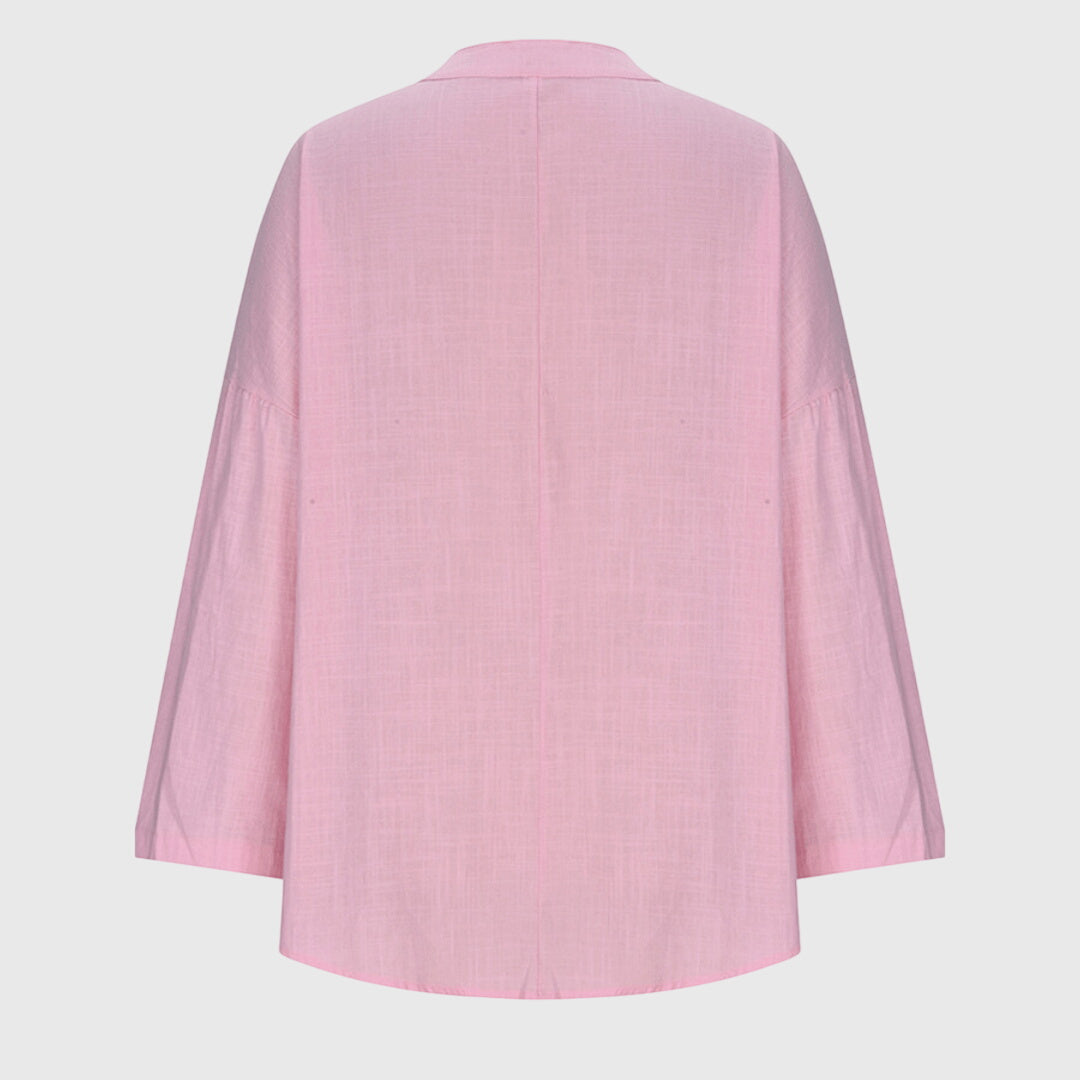 Alsidig og moderne langærmet dametop. Løs pasform for maksimal komfort, perfekt til casual og stilrene looks.
