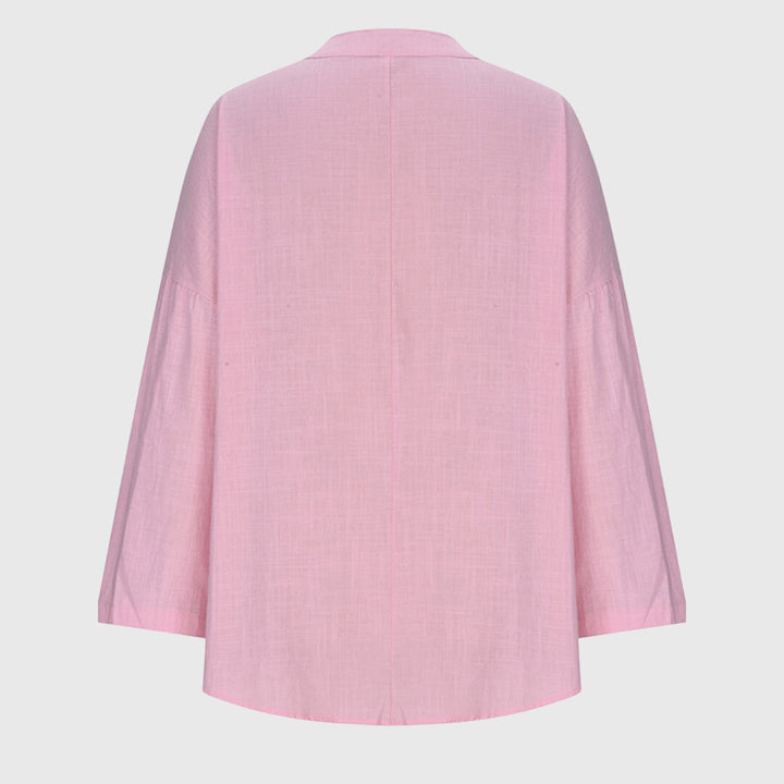 Alsidig og moderne langærmet dametop. Løs pasform for maksimal komfort, perfekt til casual og stilrene looks.