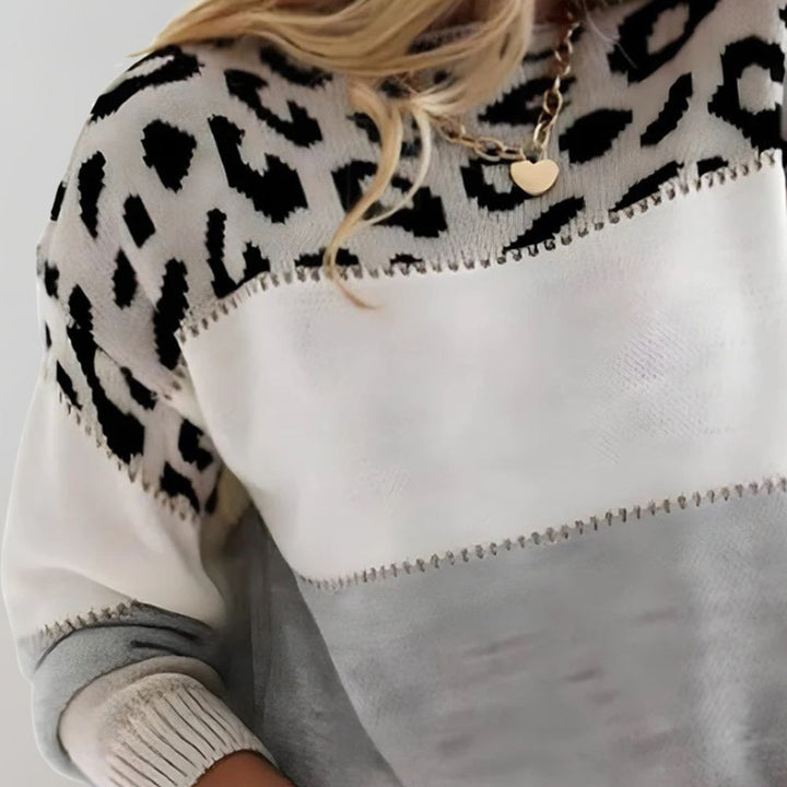 Trendy dame leopard striktrøje med farveblok. Perfekt til efterår og vinter, giver afslappet komfort.