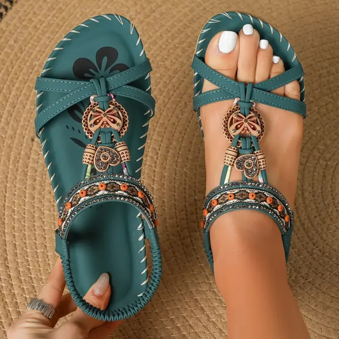 Dame ortopædiske sandaler i klassisk sort. Designet for komfort, fodstøtte og stil til sommerens lange dage.