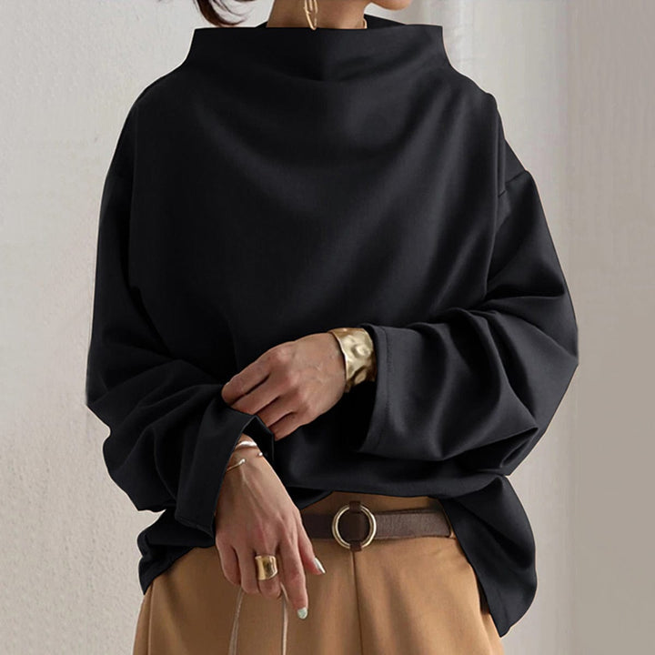 Dame oversize sweatshirt med høj hals i stilfuld sort, perfekt til afslappet komfort og minimalistisk mode.