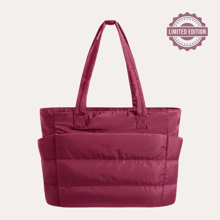 Perfekt rummelig dame tote, polstret design for maksimal komfort og stil.