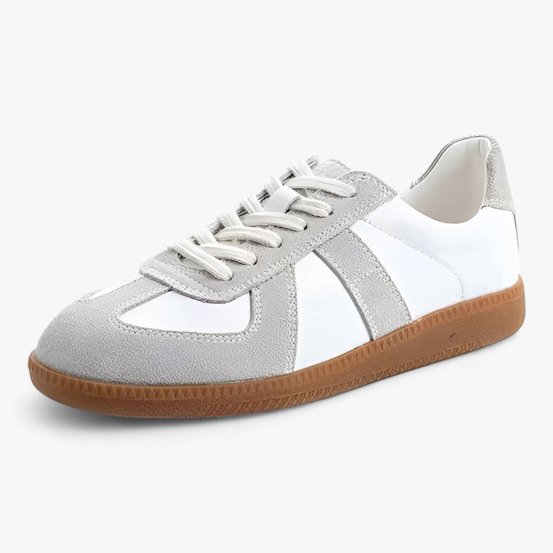"Dame sneakers i ægte læder, stilfuldt design med klassisk look i hvid og sort, ideelle til daglig komfort og elegance."