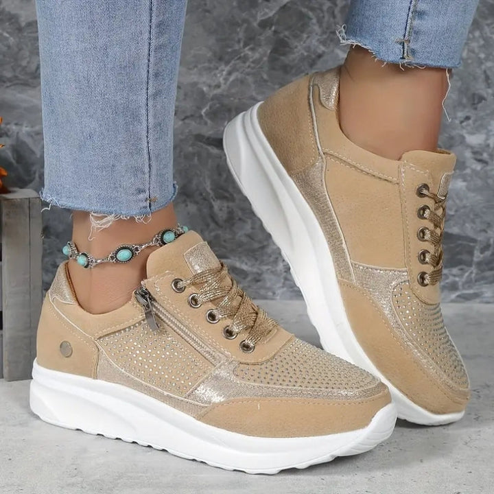Stilrene dame sneakers med rund snude og praktisk lynlås. Letvægt og skridsikre til den urbane kvinde.