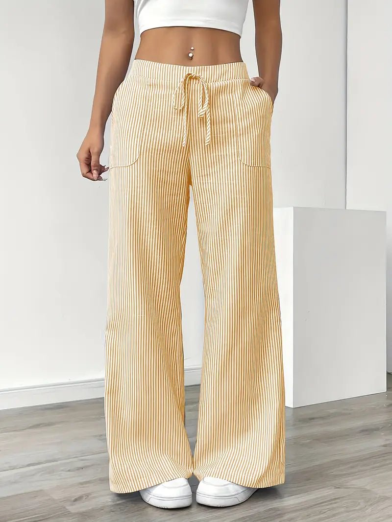 Dame stribede wide leg bukser med lommer, ideelle til sommer. Afslappede og stilfulde sommerbukser.