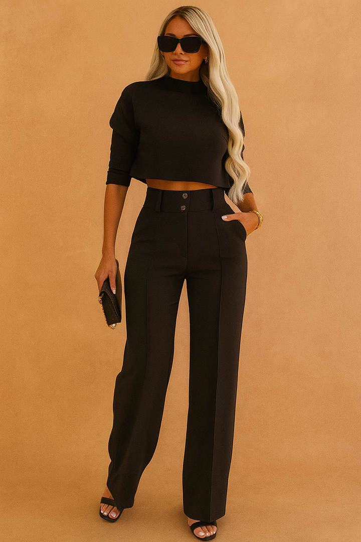 Dame todelt sæt med stilfuld crop top og elegante vide benbukser. Perfekt til fest og fritid.