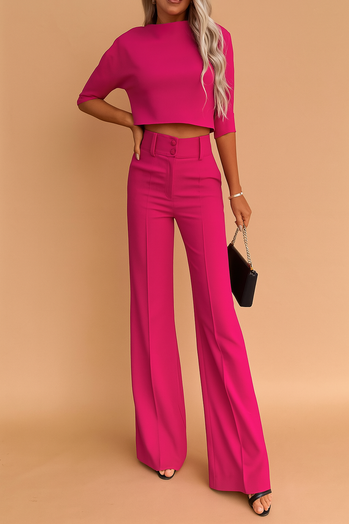 Alsidigt dame todelt sæt med chic crop top og vide bukser. Ideelt til forretning, fest eller fritid.