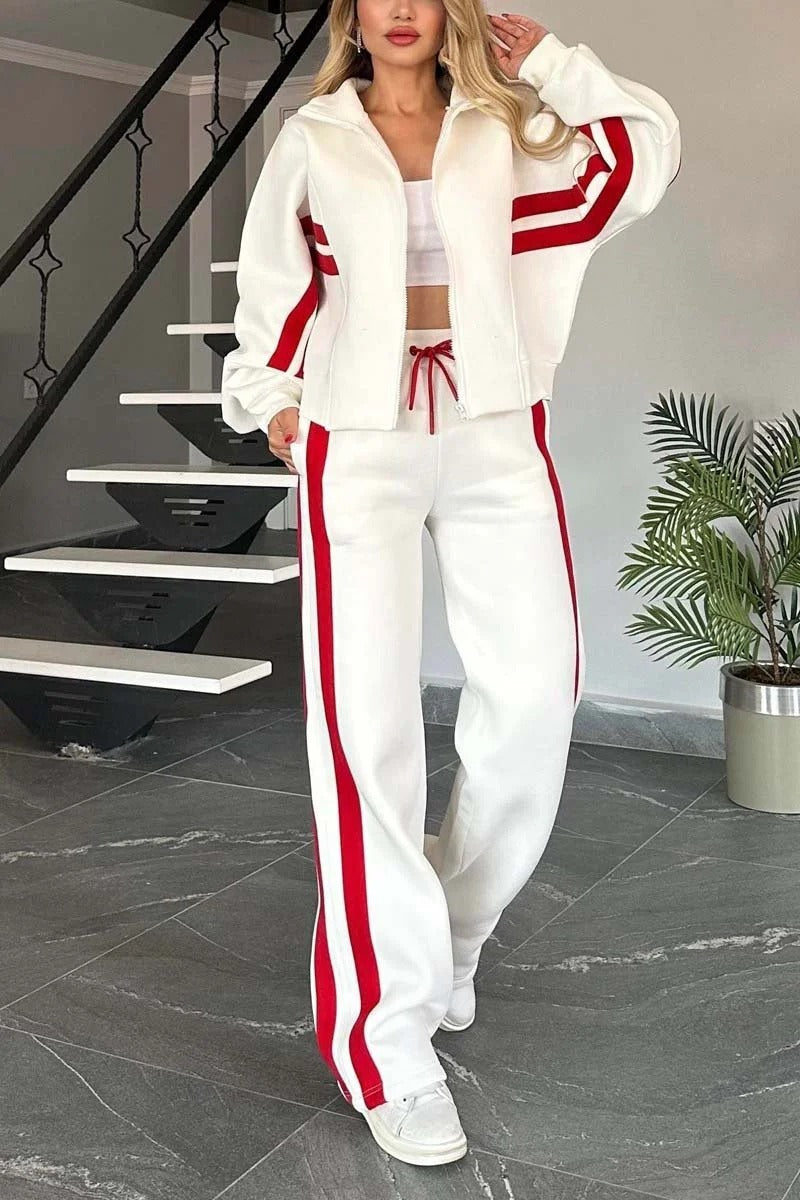 Dame træningssæt med lynlåsjakke og matchende bukser for komfort og sporty stil. Ideel til fritid og activewear.