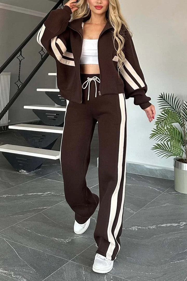 Moderne todelt dame fritidssæt med sporty lynlåsjakke og bukser, tilbyder ultimativ komfort og stil.