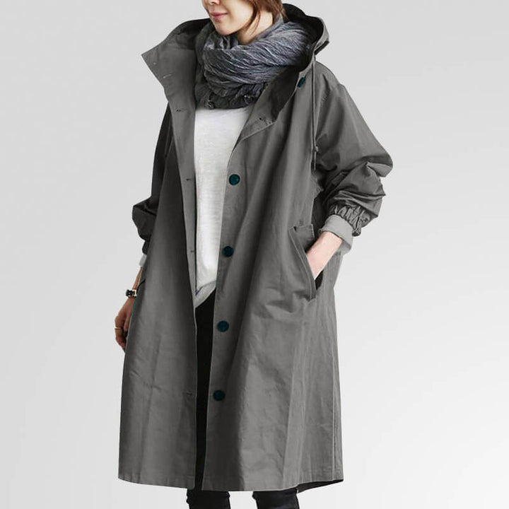 Dame trenchcoat med hætte, perfekt til overgangsperioder. Stilfuld og komfortabel letvægtsjakke.