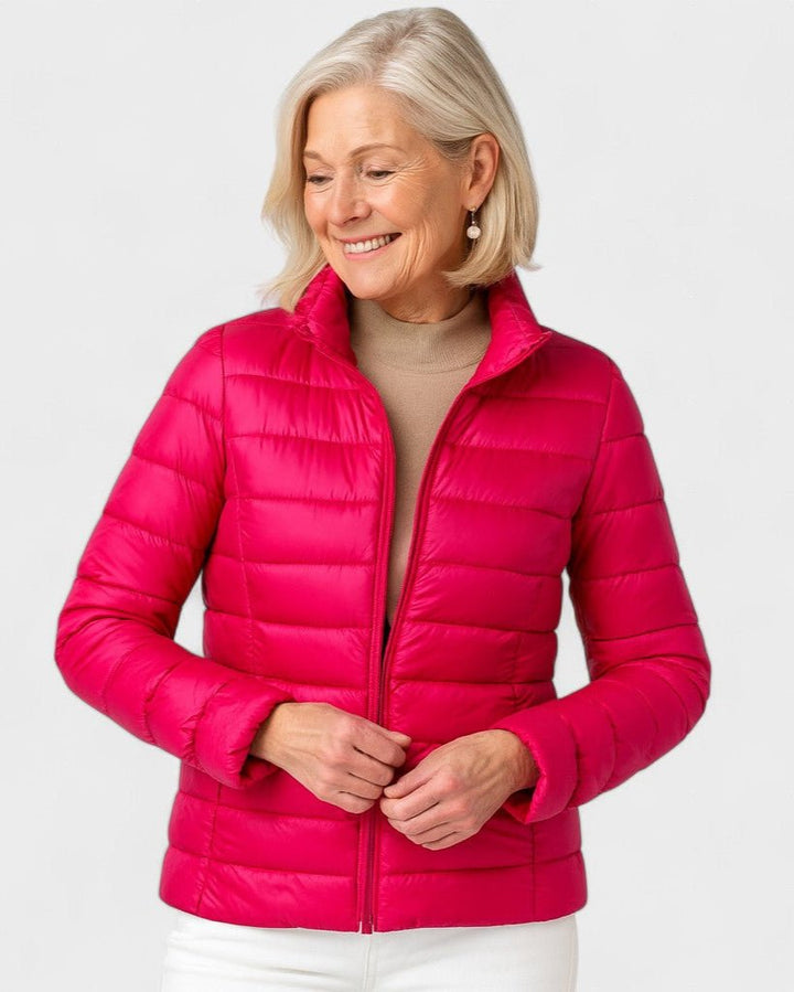 Dunfyldt damejakke, ultralet og isolerende, perfekt til koldt vejr og rejsebrug.