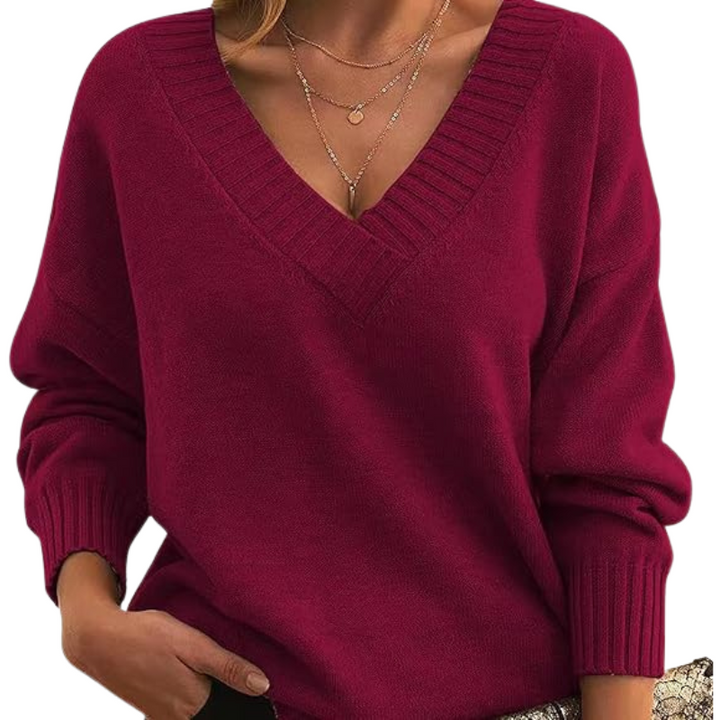 Stilfuld V-hals strik sweater til damer. Afslappet pasform, ideel som komfort sweater til kvindemode.