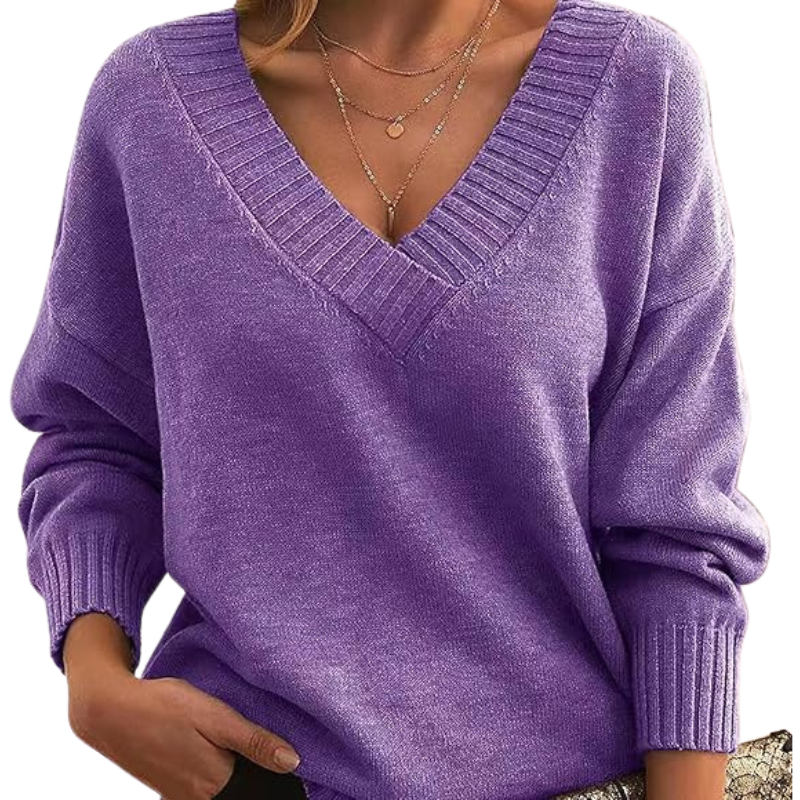 Komfortabel V-hals sweater i strik. Dame model med afslappet pasform, ideel til vinterjakke.