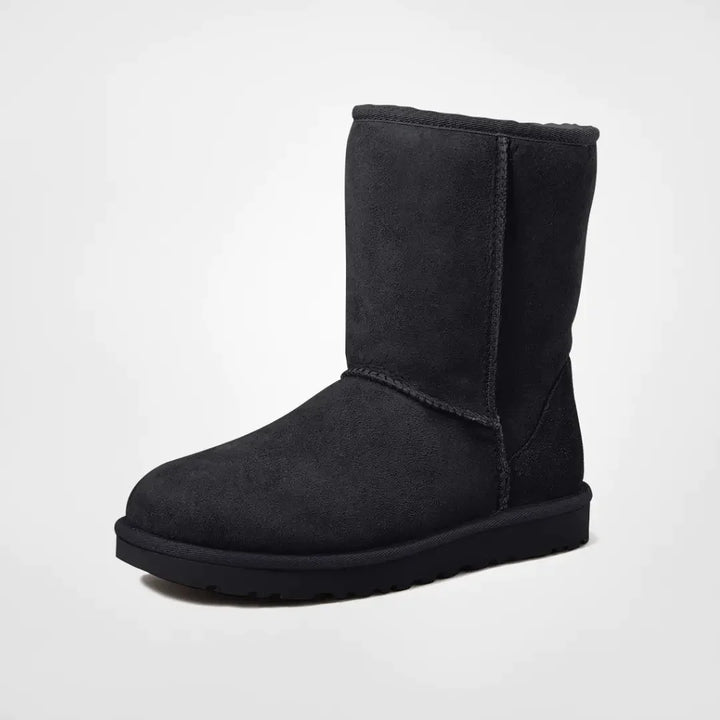 Sorte dame vinterstøvler i læderlook med varmt for, perfekte til modebevidste kvinder i sne.