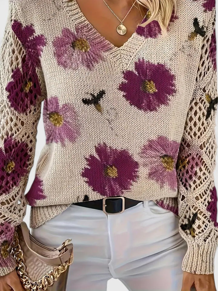 Elegant damebluse med V-hals, blomstermønster og transparente blondeærmer. Til hverdag og fest.
