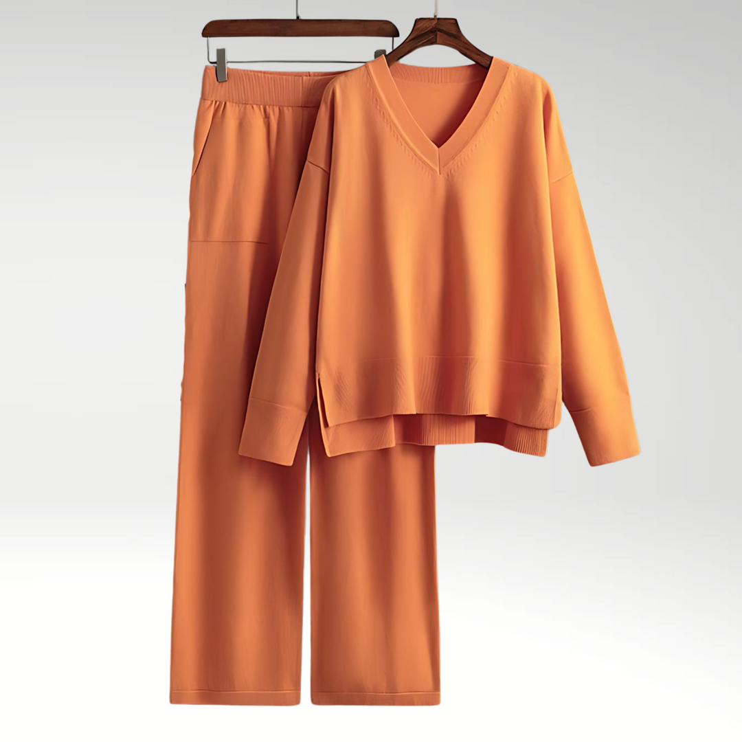Stilfuldt damesæt i moderne design: V-hals bluse og matchende bukser. Casual mode til kvinder.