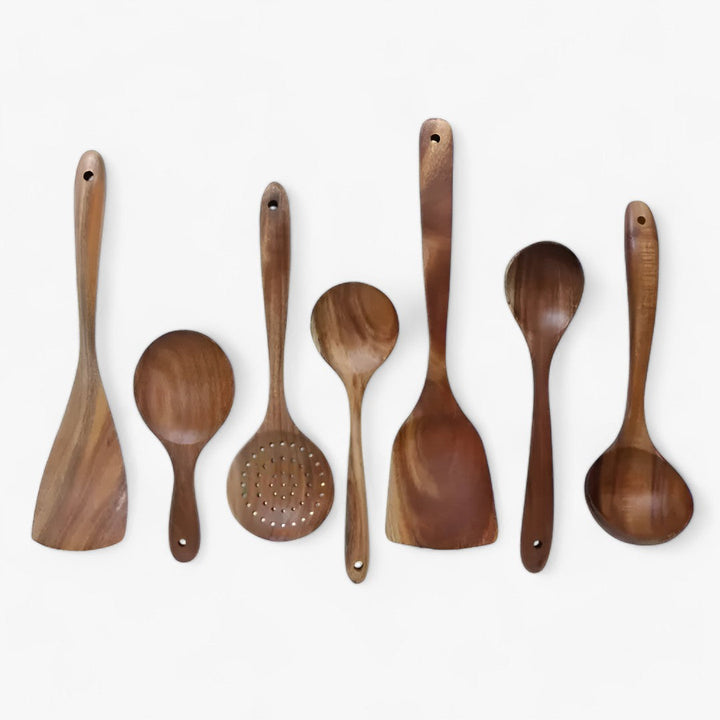 "Elegant 7-delt køkkenredskabssæt i moderne design med ergonomiske håndtag, perfekt til enhver køkkenindretning."