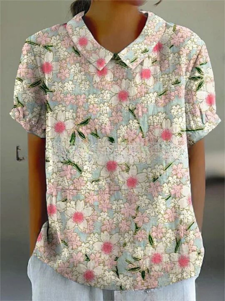 "Elegant Amanda Blomster Top i letvægtsstof, med smukt blomsterprint og afslappet pasform, perfekt til uformelle lejligheder.