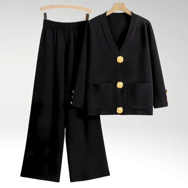 Model iført et elegant blazer sæt til kvinder med brede bukser. Perfekt til kontor, fest og et moderne look.