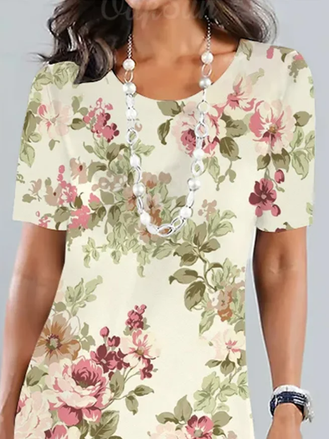 "Elegant blomster midi kjole med rund hals, perfekt til havefest; har smukt blomsterprint og løs pasform for komfort og stil.